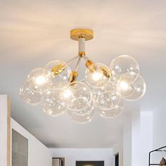 a chandelier hanging from the ceiling in a living room