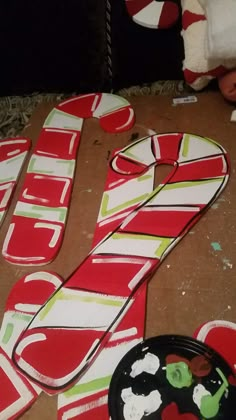 some candy canes are laying on the floor