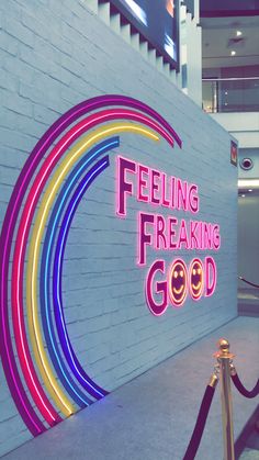 a neon sign that says feeling freaking good