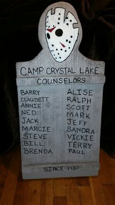 a sign that says camp crystal lake with an image of a hockey mask on it