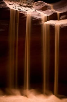 the water is flowing over the rocks in the desert, and it looks like they are going