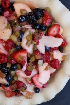 a fruit salad is shown in a pie crust