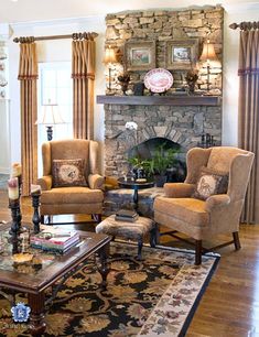 a living room filled with furniture and a fire place