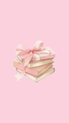 a stack of books with a pink bow on top