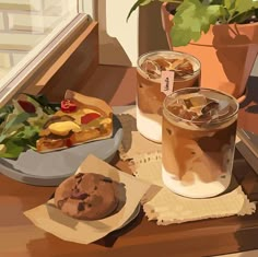 two glasses of iced coffee sit on a window sill next to a plate of food and a potted plant