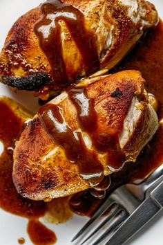 Two grilled chicken breasts drizzled with a dark sauce, with a fork beside them. Healthy Sauces For Chicken