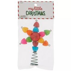 a packaged package of christmas candies in the shape of a snowflake with bells