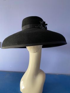 This beautiful large fur felt brimmed hat in black hand blocked custom-made by Wendy White Millinery. Add an air of elegance to your wardrobe whether it be for the races or a different event. This Hats head size is 22 1/2 inch Classic Felt Hat For Kentucky Derby Evening, Classic Evening Felt Hat For Kentucky Derby, Elegant Wide Brim Felt Hat For Kentucky Derby, Black Top Hat With Wide Brim For Evening, Elegant Wide Brim Felt Hat For Evening, Classic Kentucky Derby Evening Felt Hat, Black High Crown Top Hat For Races, Black Wide Brim Top Hat For Evening, Black Evening Top Hat With Wide Brim