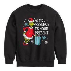 a black sweatshirt with the grin on it saying, my presence is your present