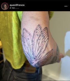 a person with a tattoo on their arm