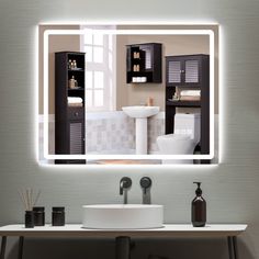 a bathroom with a sink, mirror and shelves on the wall above it that is lit up