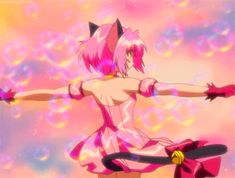 an anime character with pink hair holding her arms out in front of a colorful background