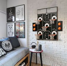 a living room filled with furniture and pictures on the wall