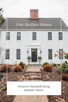 a white house with the words our saltbox home on it's front door