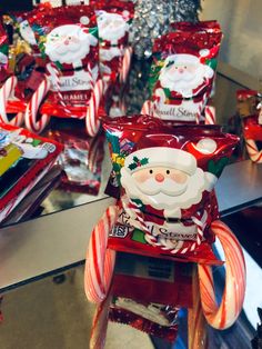 candy canes and santa clause candies are on display