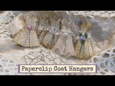 paperclip coat hangers are lined up on a lace doily with the words, paperclip coat hangers