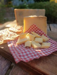 cheese and crackers on a picnic table