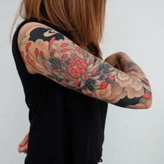 a woman with a tattoo on her arm