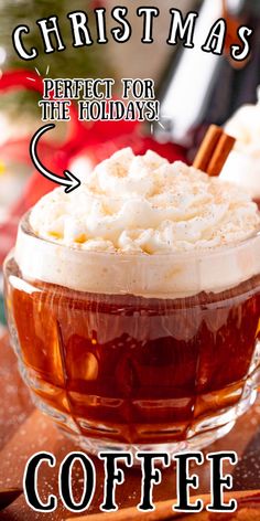 a glass cup filled with hot chocolate and whipped cream