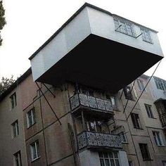 an upside down apartment building with balconies