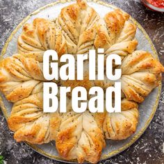 garlic bread on a plate with the words garlic bread in front of it, surrounded by other food items