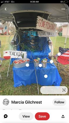 an image of food being served on the back of a car in front of a tent