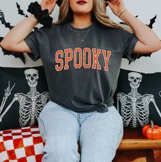 👻 Spooky - Comfort Colors Unisex TShirts 👻 Get ready for all things spooky with our "Spooky" shirt! Perfect for celebrating Halloween and embracing the eerie vibes. Features: Spooky "Spooky" design with a touch of eerie charm 🎃🕸️ Soft and comfy fabric for hauntingly good comfort 👕 Ideal for Halloween parties, haunted houses, or just getting into the spirit of the season 👻🦇 Embrace the spooky season with style! #SpookySeason #HalloweenFashion #EerieVibes #SoftAndComfy #HauntinglyGood #Chic Grunge Tops With Text Print For Halloween, Grunge Text Print Top For Halloween, Horror Style Letter Print Tops For Fall, Grunge T-shirt With Text Print For Fall, Grunge Style Text Print Tops For Halloween, Spooky Fall Tops With Screen Print, Spooky Screen Print Tops For Fall, Spooky Halloween Tops, Spooky Halloween Top With Letter Print