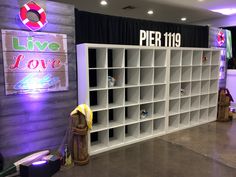 a large book shelf with lots of books on it in front of a live love sign