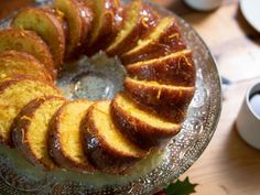 a cake on a glass plate with slices cut out