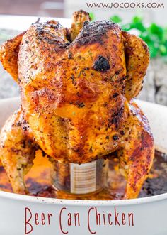 a cooked chicken sitting on top of a pan