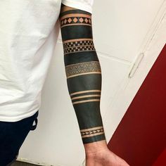 a man with a tattoo on his arm