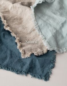 three different colors of fabric with the word natural written on them in white and blue