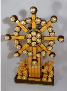 a clock made out of gold and chocolates