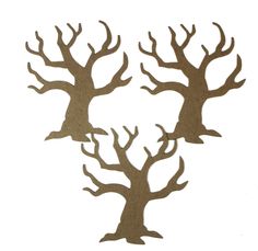 three brown tree cut outs on white paper