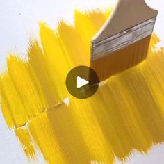 the paint is yellow and has a brush in it