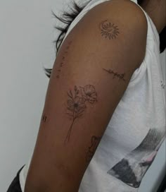 a woman with a flower tattoo on her arm