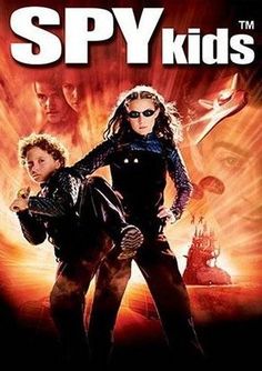 the dvd cover for spy kids is sitting on top of a piano keyboard and it's case