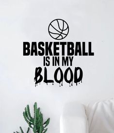 a basketball is in my blood wall decal on a white wall next to a potted plant