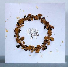 a handmade card with an image of a wreath