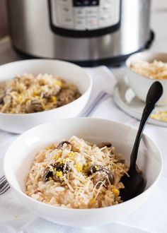 two white bowls filled with food next to an instant pot