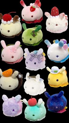 several stuffed animals with different colors and sizes