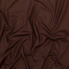 a close up view of a plain brown fabric