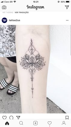 a woman's leg with a lotus tattoo on the left side of her arm