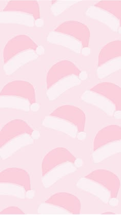 a pink background with santa hats on it