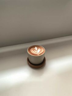 a cappuccino sitting on top of a white counter