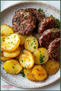 some meatballs and potatoes on a plate with parsley sprinkled around them