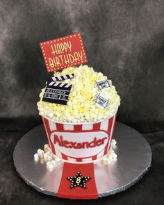 a birthday cake made to look like a popcorn bucket