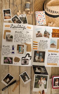 an open book with pictures and other items on it sitting on a wooden table next to a straw hat