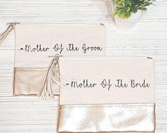 mother of the groom and mother of the bridal pouches on a white table