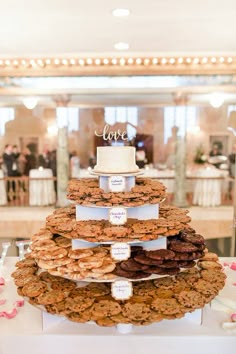 a wedding cake made out of cookies on top of a table